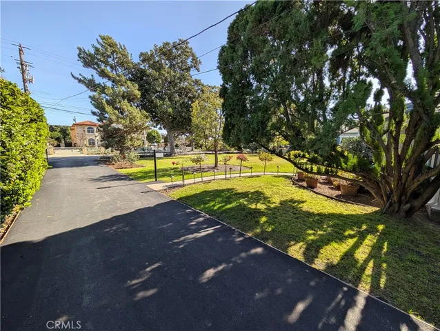 an empty room with wooden floor and painting on the wall