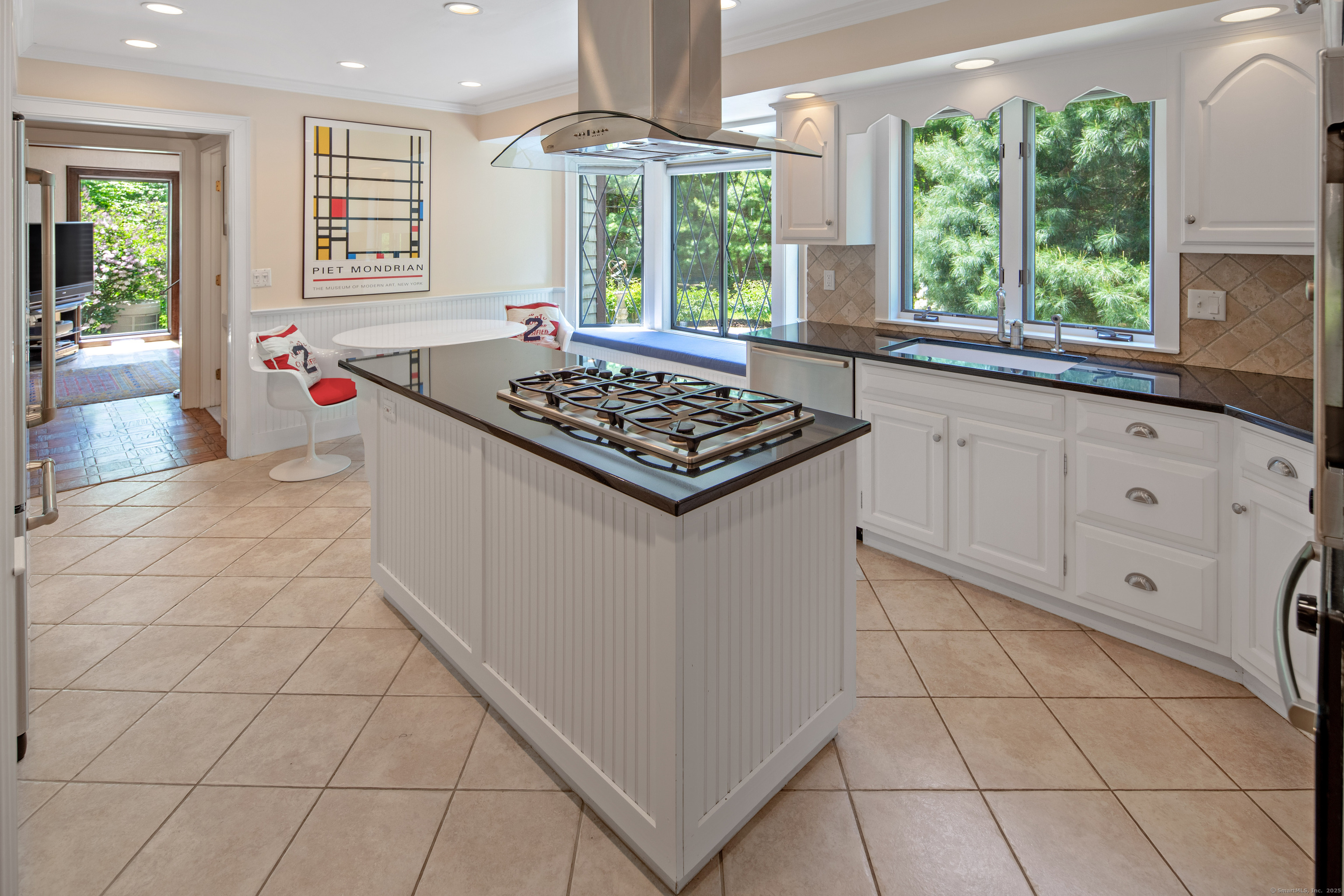 15 Tunxis Trail Redding, CT 06896 - Photo 12 of 27 a kitchen with a stove a sink a refrigerator and window