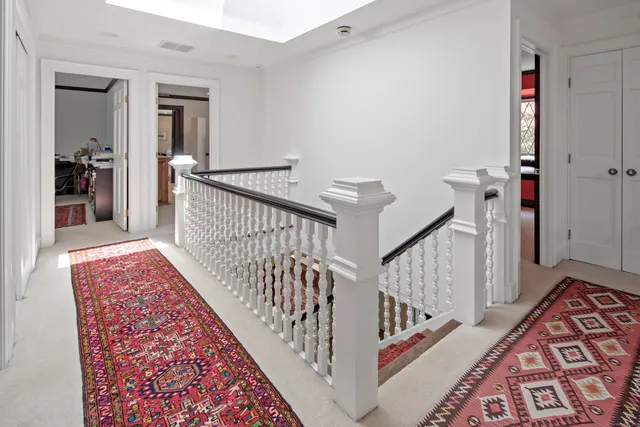 a view of staircase with white walls