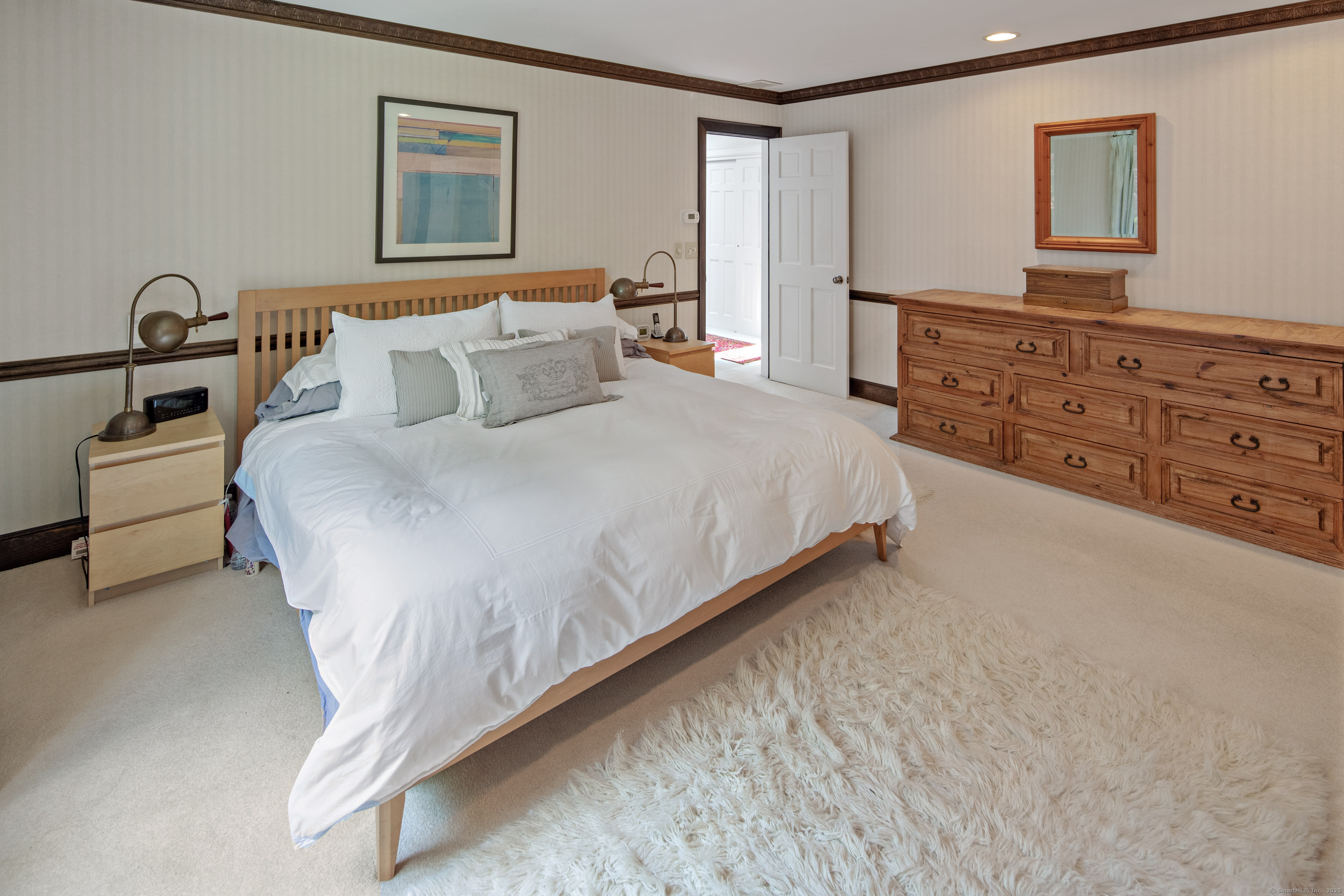 15 Tunxis Trail Redding, CT 06896 - Photo 18 of 27 a bedroom with a bed and a dresser