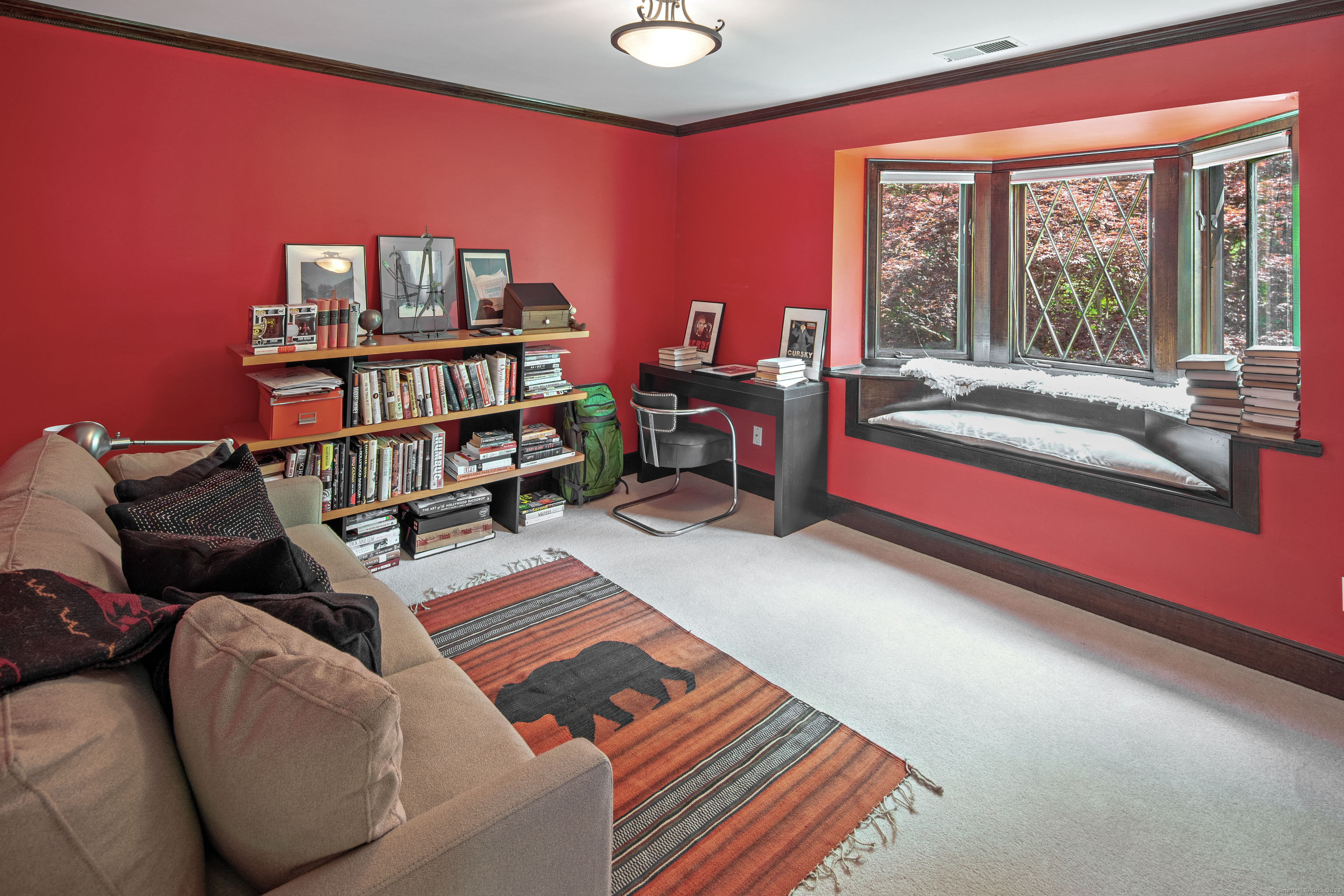 15 Tunxis Trail Redding, CT 06896 - Photo 20 of 27 a living room with furniture and a book shelf