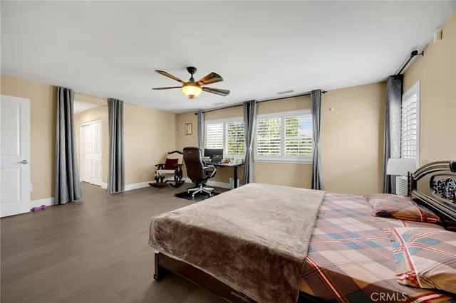 a bedroom with bed and window