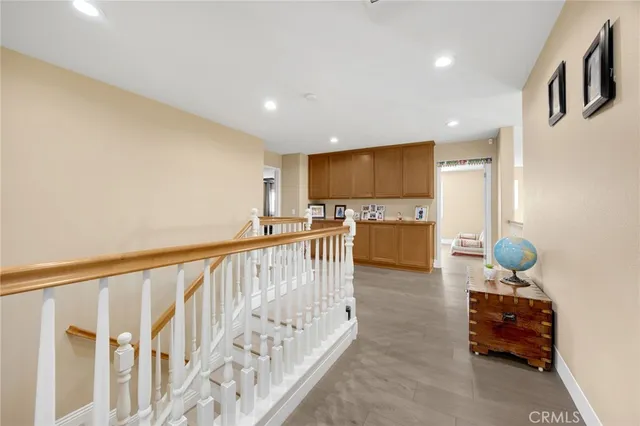 a view of kitchen with furniture and refrigerator