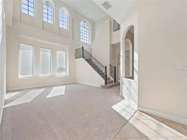 a view of an entryway with wooden floor and door