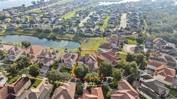 an aerial view of residential houses with outdoor space
