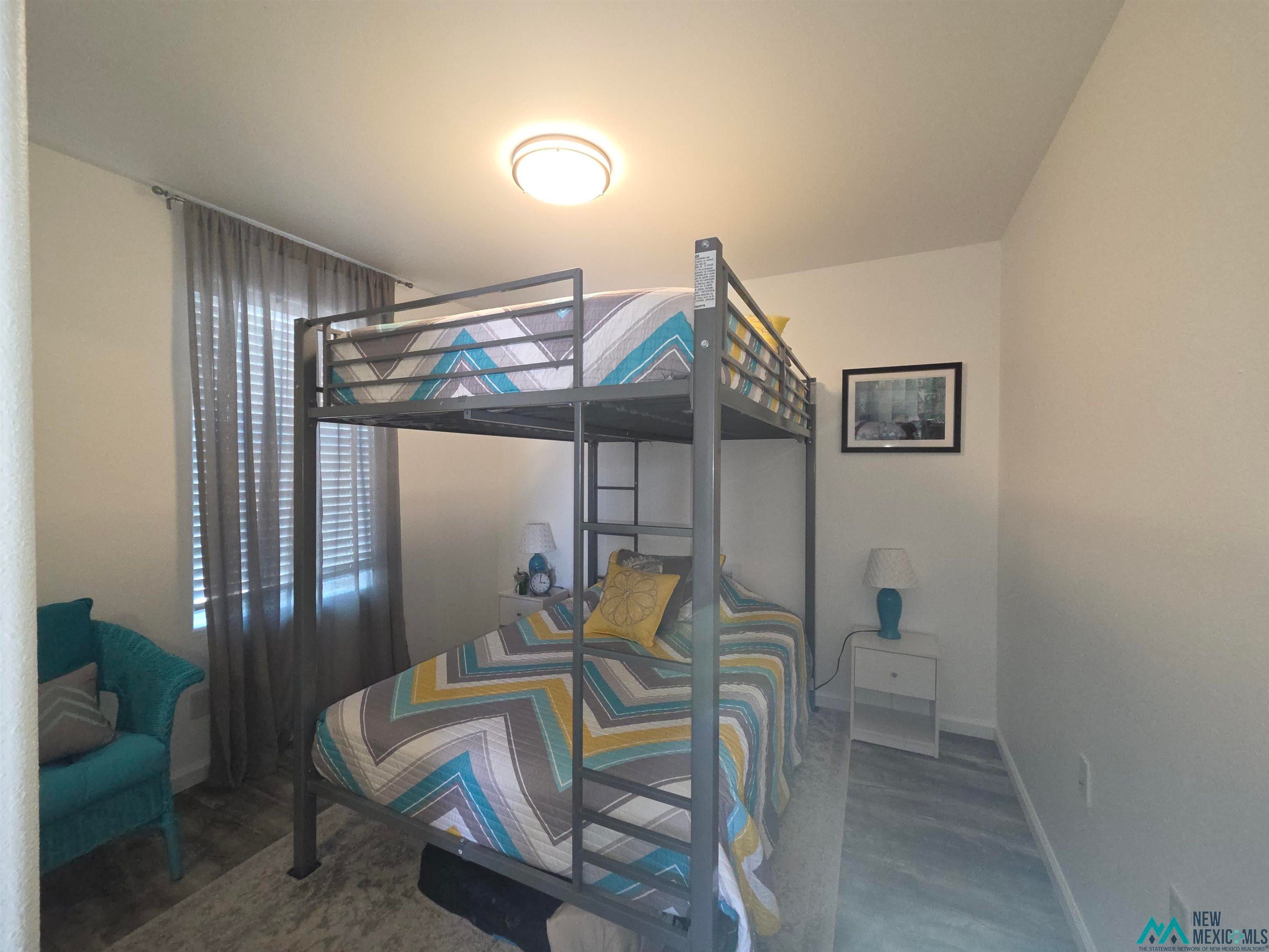 407 Bass Road Elephant Butte, NM 87935 - Photo 47 of 54 Bedroom featuring baseboards