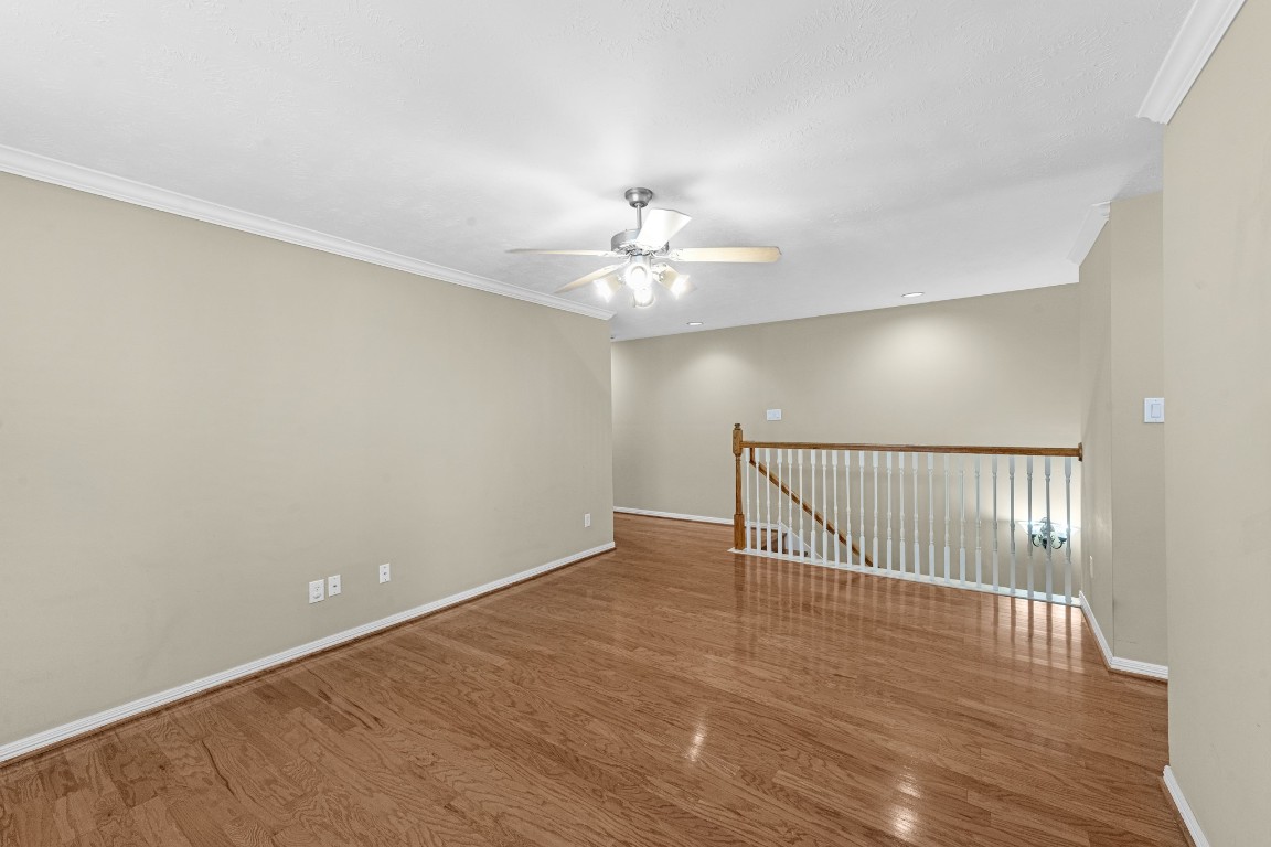 5228 Larkin Street Houston, TX 77007 - Photo 13 of 29 wooden floor in a hall with a window