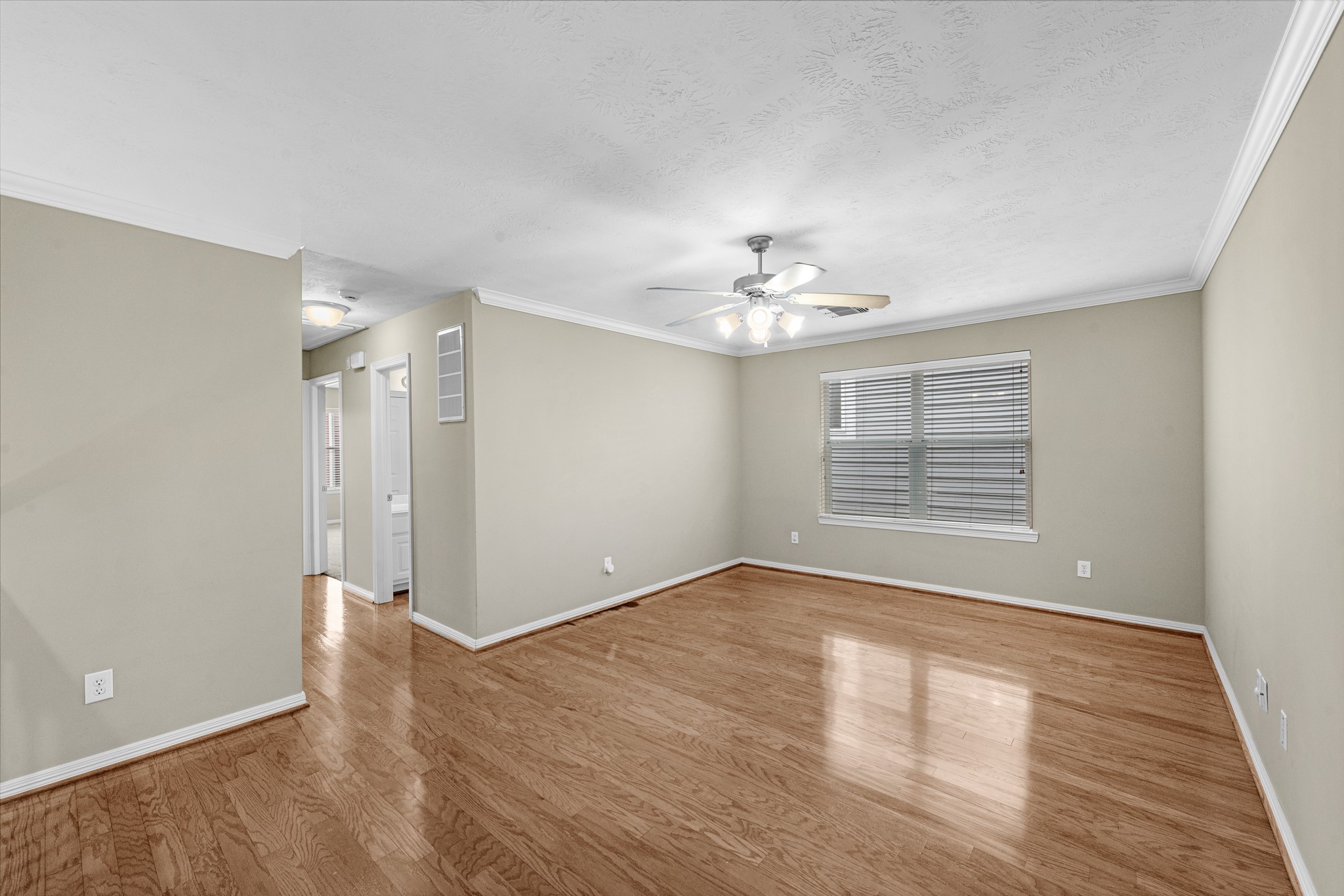 5228 Larkin Street Houston, TX 77007 - Photo 14 of 29 a view of an empty room with wooden floor and a window
