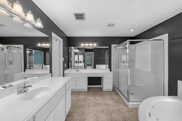 a bathroom with a bathtub and a shower