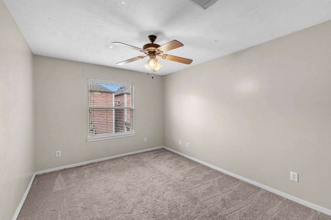 5228 Larkin Street Houston, TX 77007 - Photo 20 of 29 a view of an empty room with a window