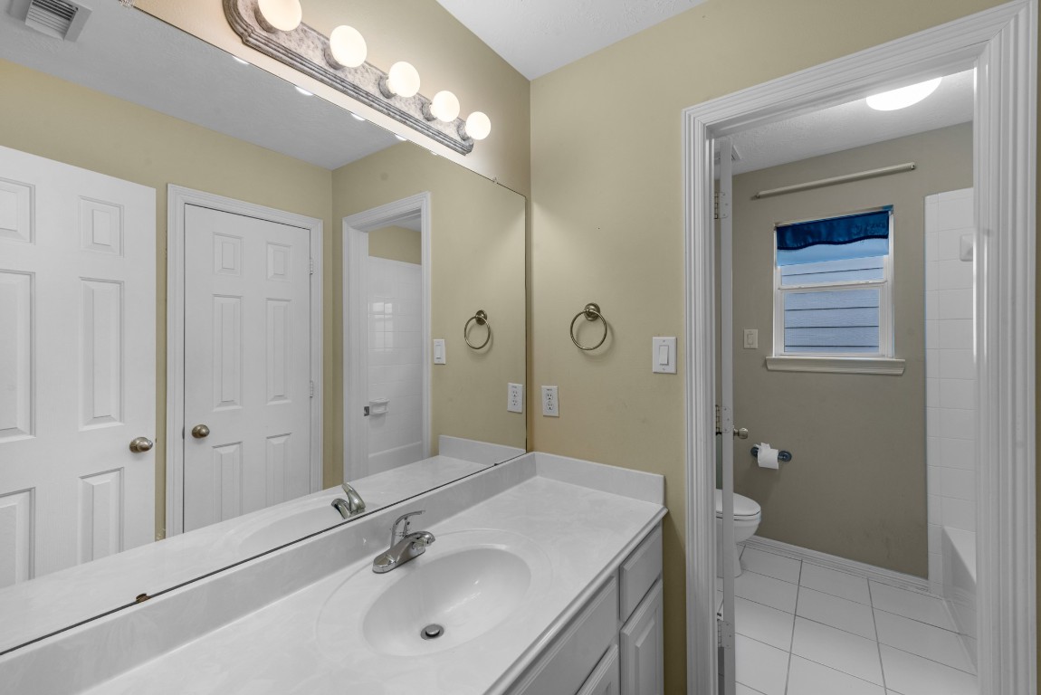 5228 Larkin Street Houston, TX 77007 - Photo 24 of 29 a bathroom with a sink a toilet and shower