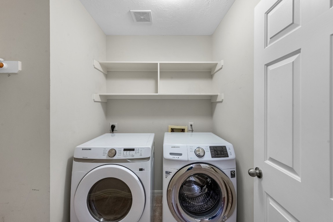 5228 Larkin Street Houston, TX 77007 - Photo 26 of 29 a view of storage and utility room with washer and dryer