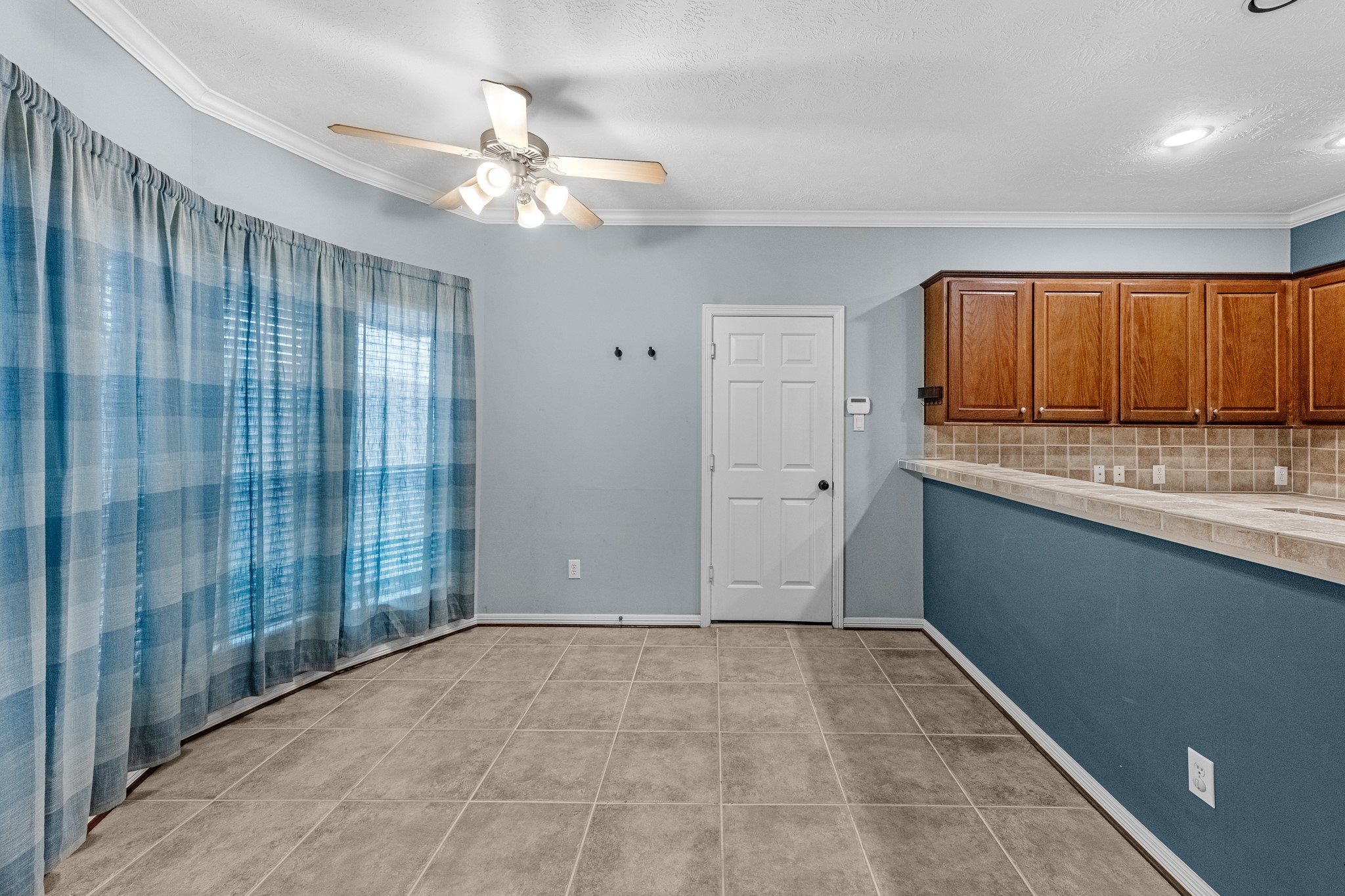 5228 Larkin Street Houston, TX 77007 - Photo 6 of 29 a view of kitchen with granite countertop cabinets and chandelier