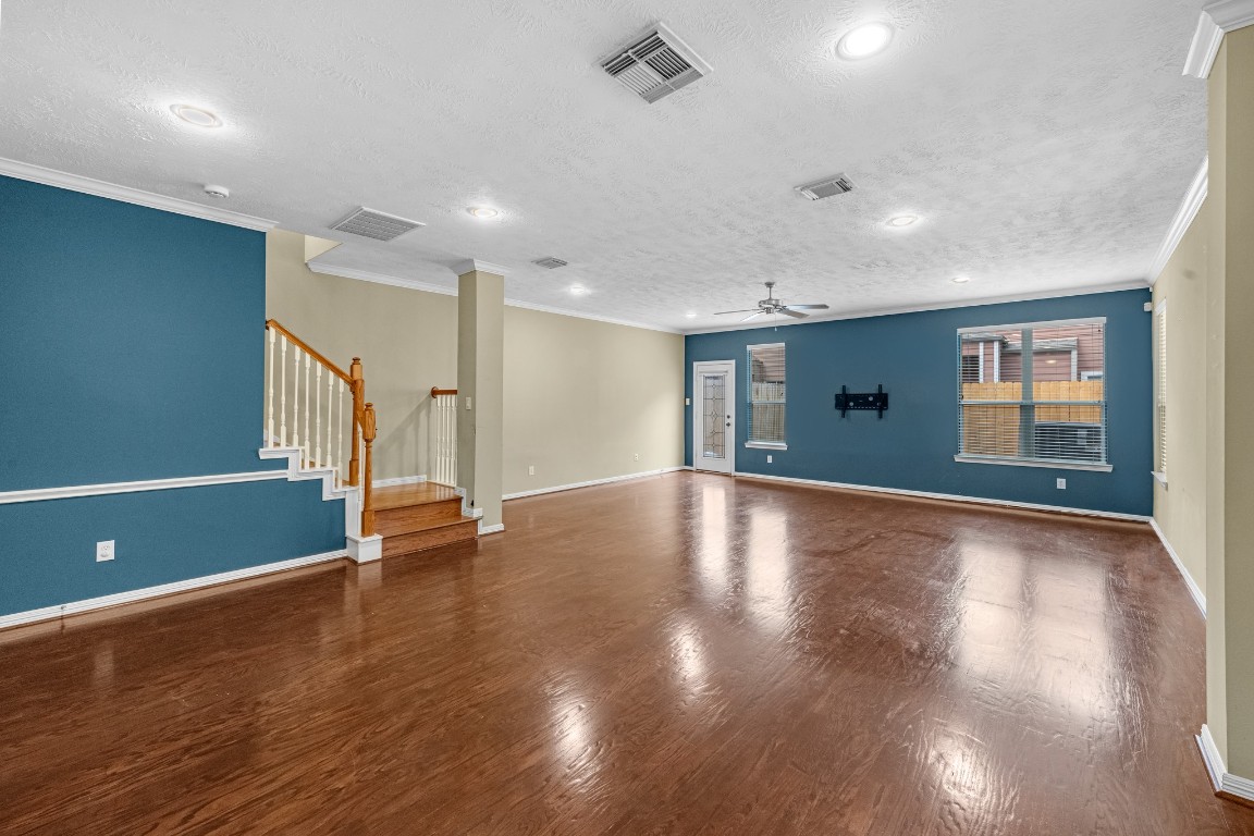 5228 Larkin Street Houston, TX 77007 - Photo 10 of 29 a view of an empty room with wooden floor and a window