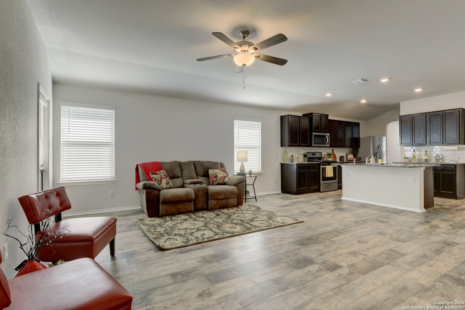 29624 Copper Crossing Bulverde, TX 78163 - Photo 11 of 33 a living room with furniture and kitchen view