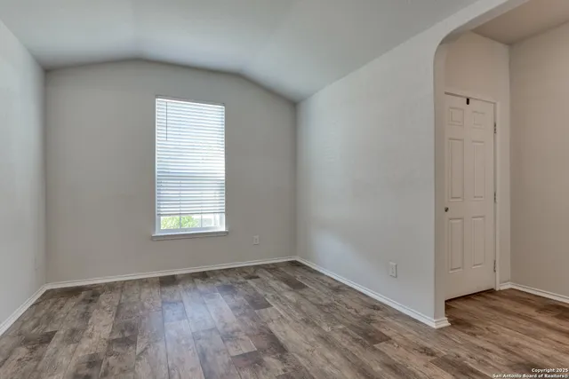 a view of a room that has a window in it