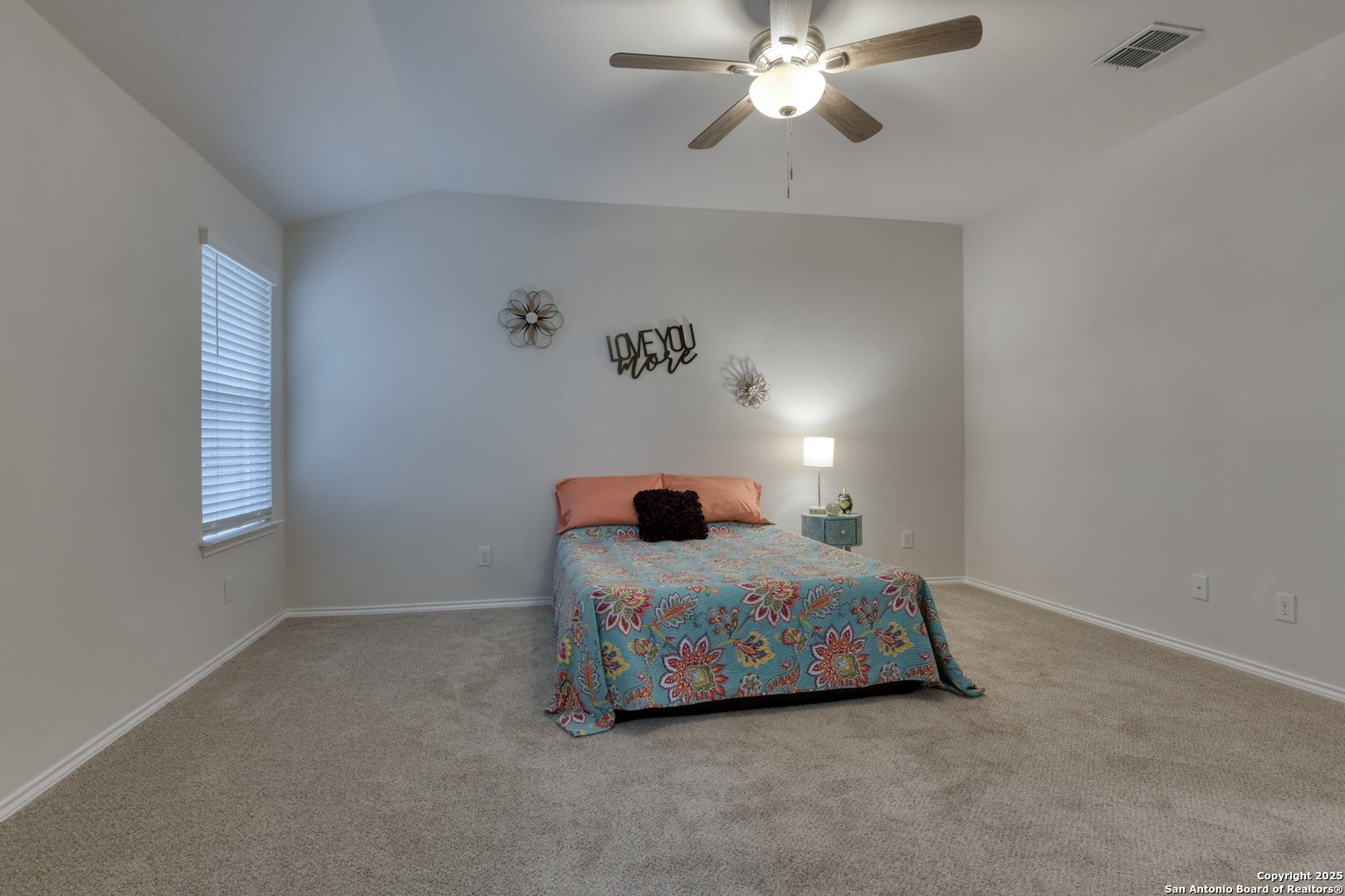 29624 Copper Crossing Bulverde, TX 78163 - Photo 14 of 33 a bedroom with a bed and a chandelier