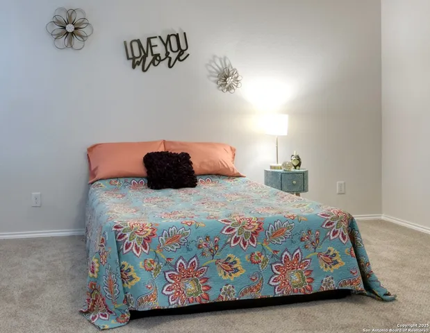 a bedroom with a bed and a table