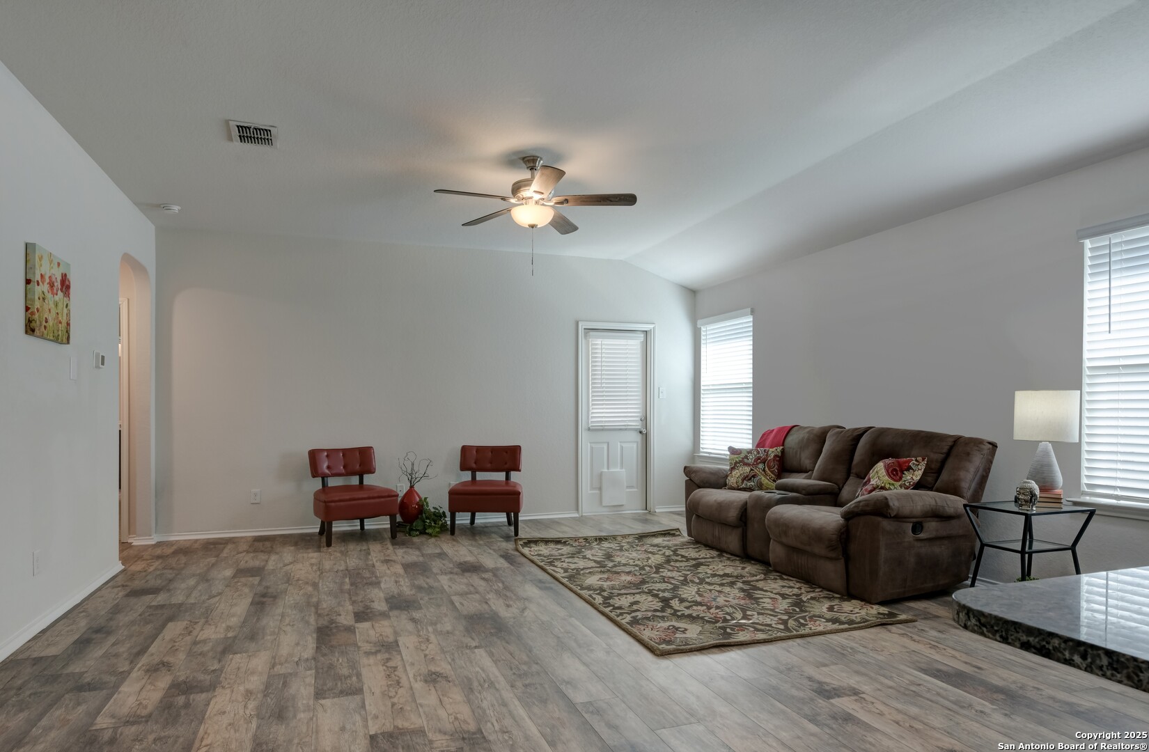 29624 Copper Crossing Bulverde, TX 78163 - Photo 8 of 33 a living room with furniture ceiling fan and a window