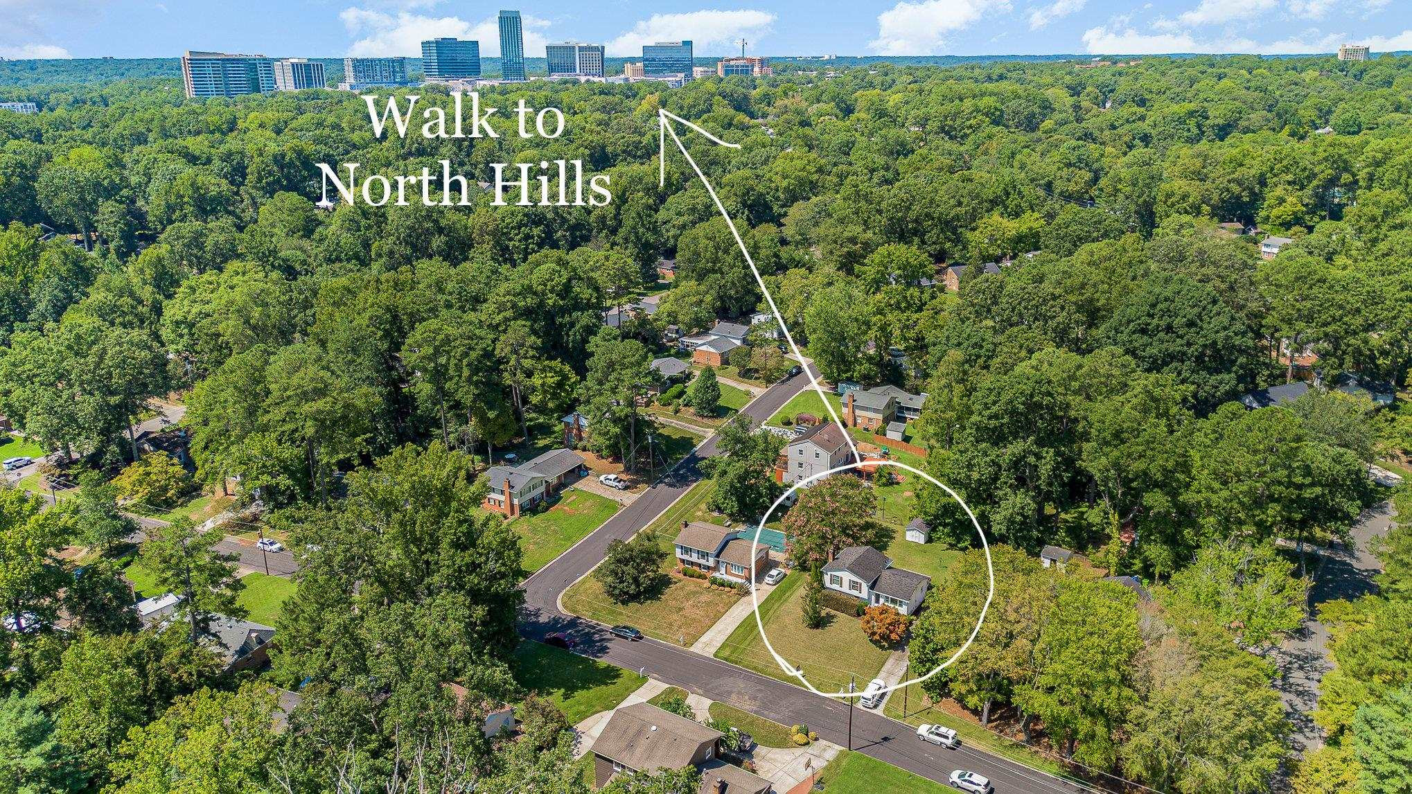 4705 Radcliff Road Raleigh, NC 27609 - Photo 4 of 29 an aerial view of a house with swimming pool and garden