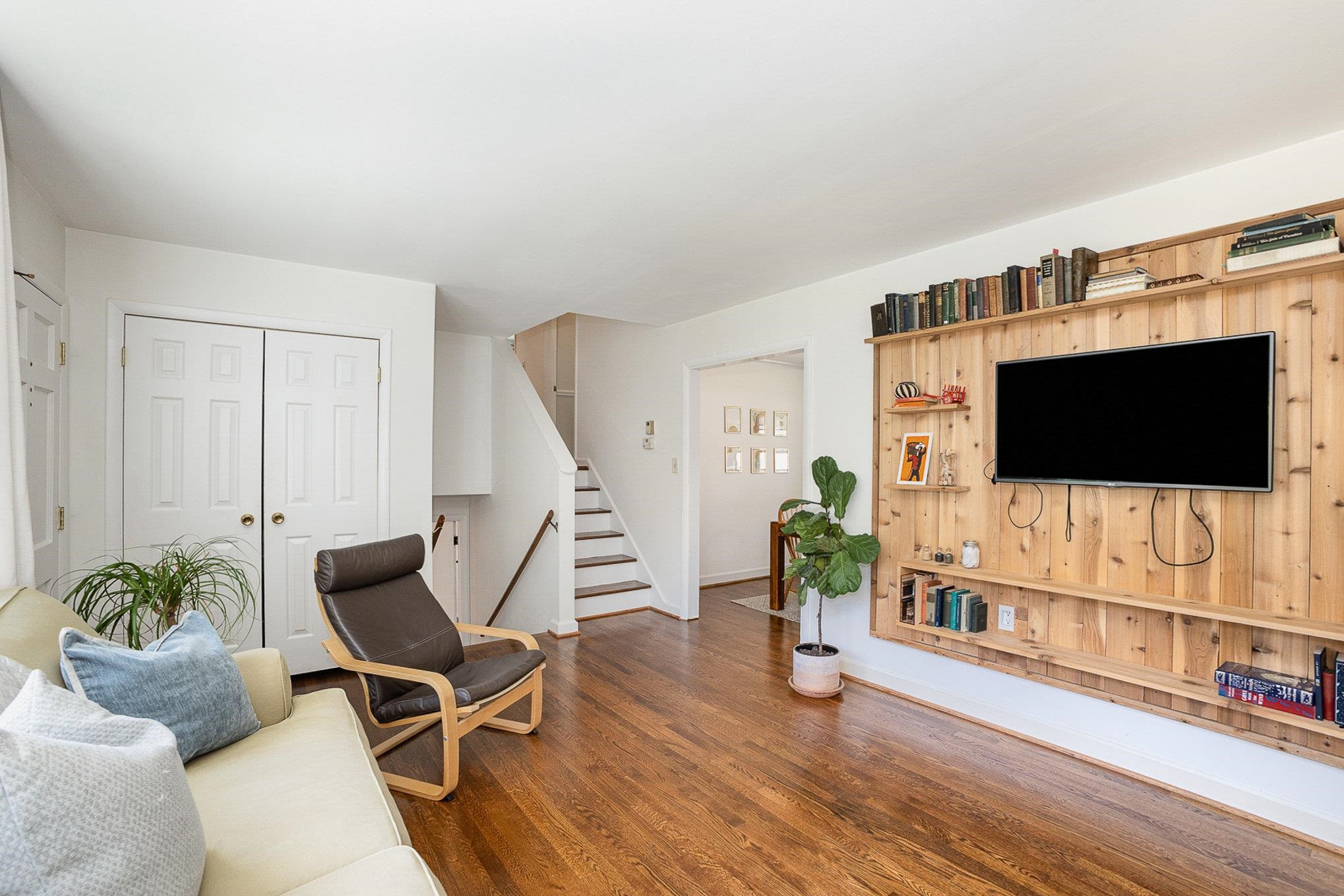 4705 Radcliff Road Raleigh, NC 27609 - Photo 6 of 29 a living room with furniture and a flat screen tv