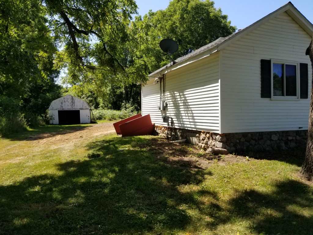 4850 Mill Road Bancroft, MI 48414 - Photo 14 of 25 Bilco door side of house with access to basement.