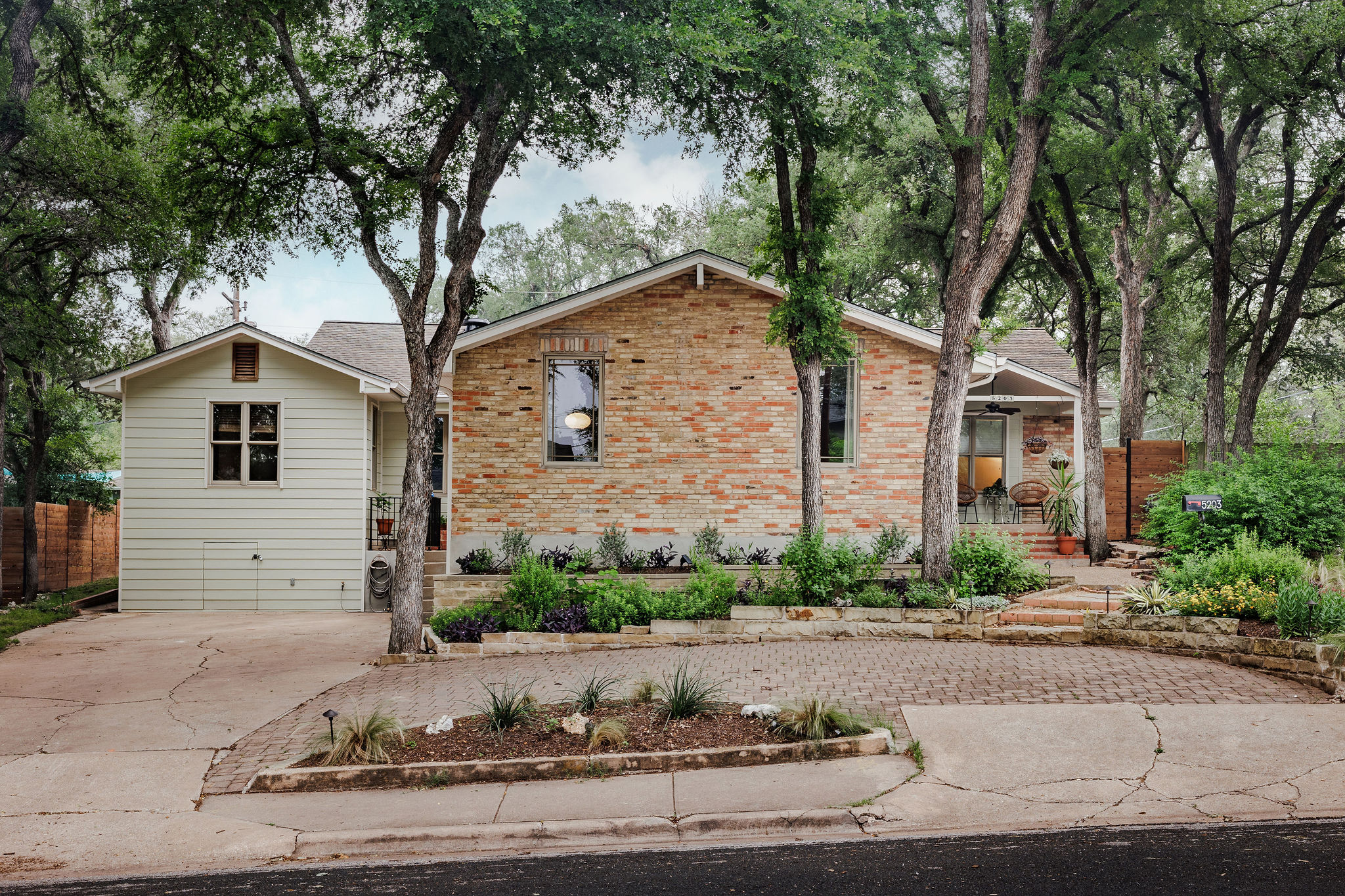 5203 Buffalo Pass Austin, TX 78745 - Photo 2 of 38 a front view of a house with garden and plants