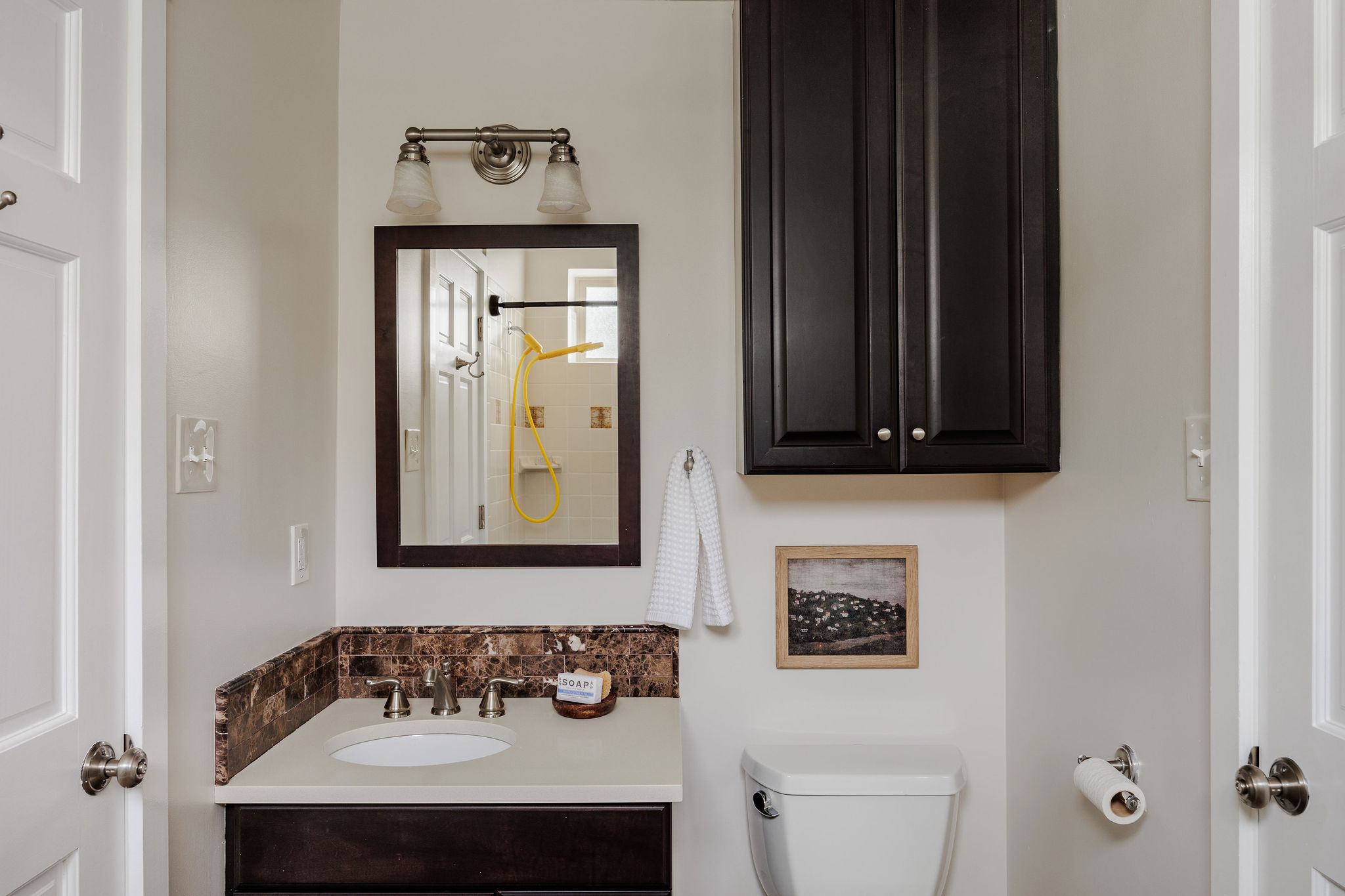 5203 Buffalo Pass Austin, TX 78745 - Photo 24 of 38 a bathroom with a sink and a mirror
