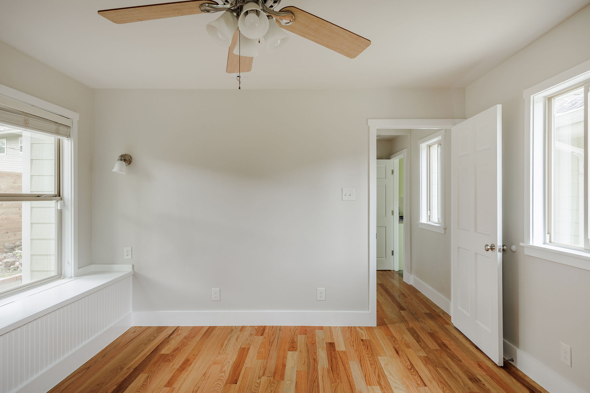 5203 Buffalo Pass Austin, TX 78745 - Photo 27 of 38 a view of a hallway with wooden floor and a window