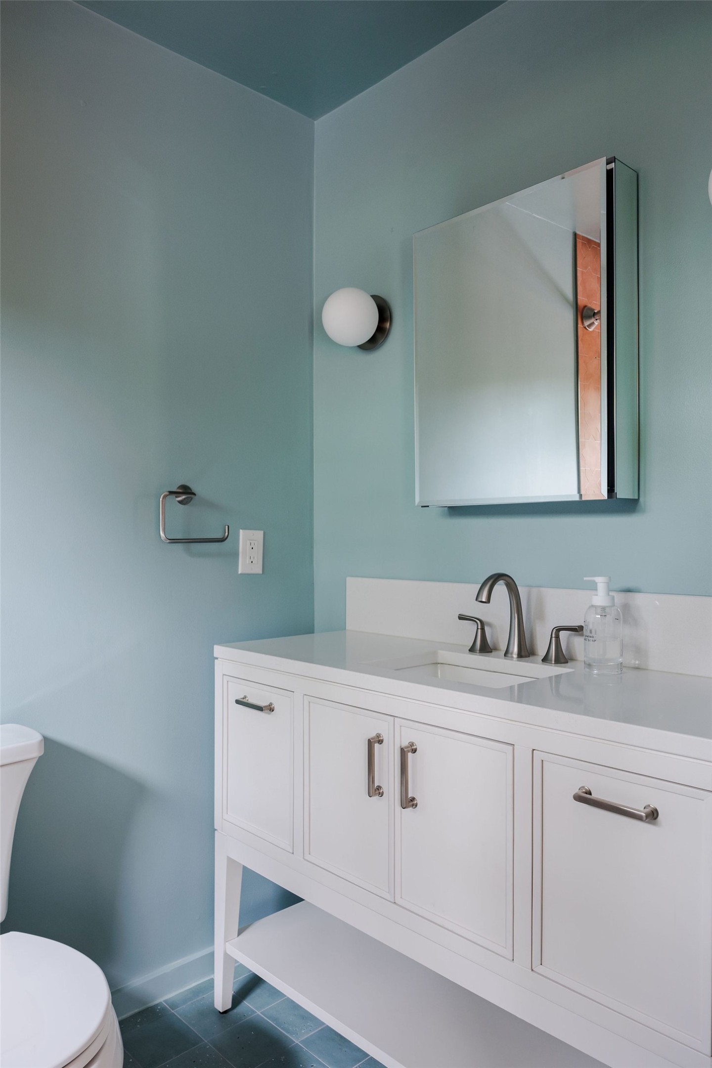 5203 Buffalo Pass Austin, TX 78745 - Photo 28 of 38 a bathroom with a toilet sink and mirror