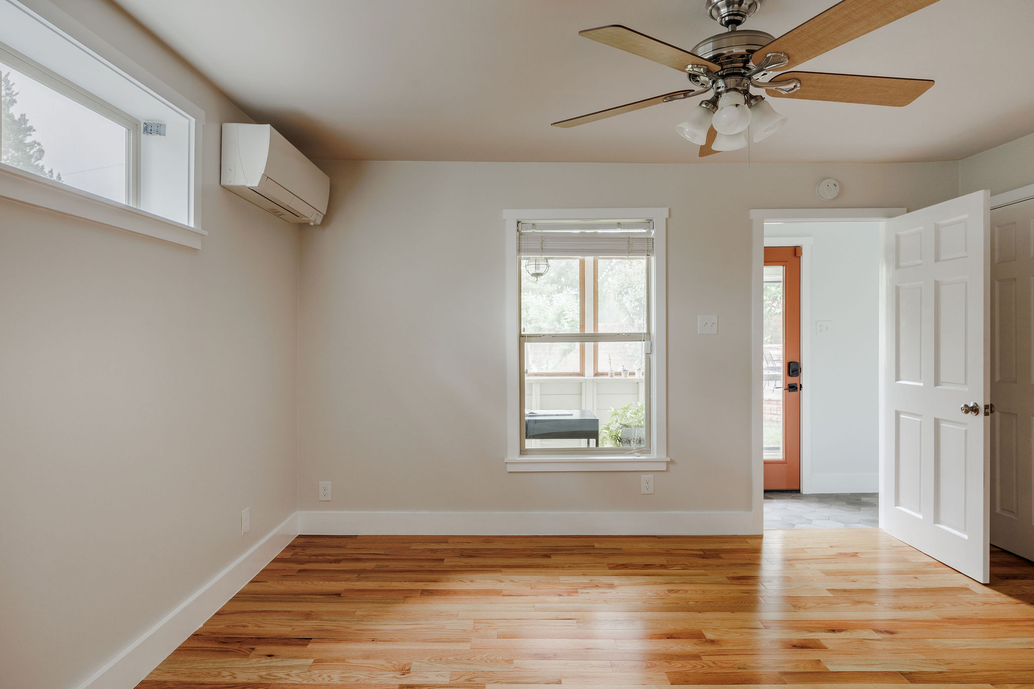 5203 Buffalo Pass Austin, TX 78745 - Photo 30 of 38 a view of an empty room with window and wooden floor