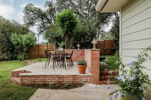 a view of a tables and chairs in patio