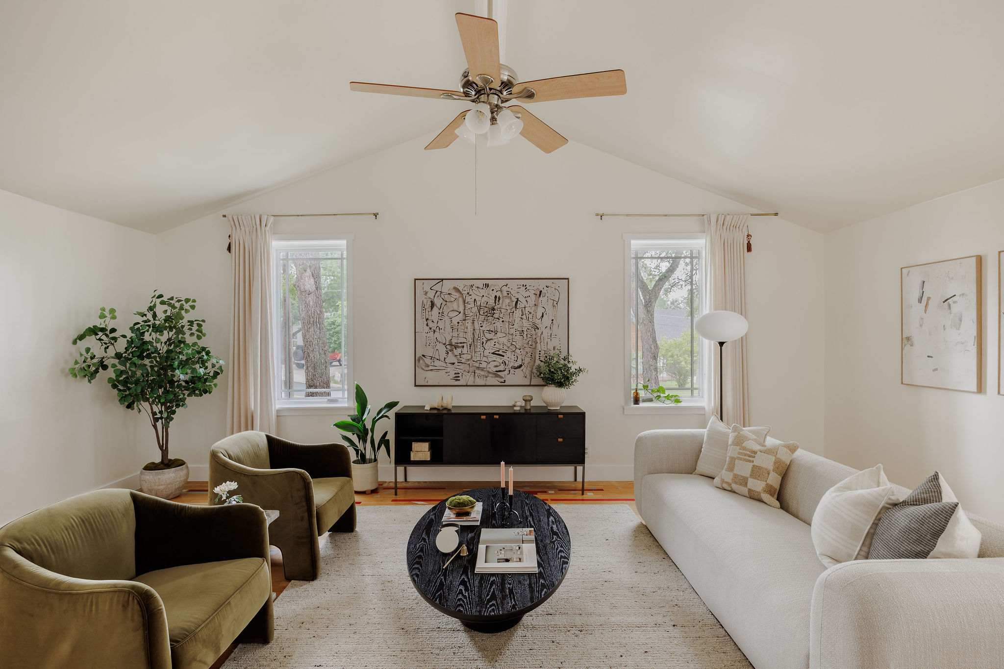 5203 Buffalo Pass Austin, TX 78745 - Photo 4 of 38 a living room with furniture a chandelier and a window