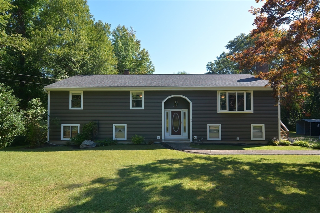 100 Cutler Road Warren, MA 01083 - Photo 1 of 42 a house view with a garden space