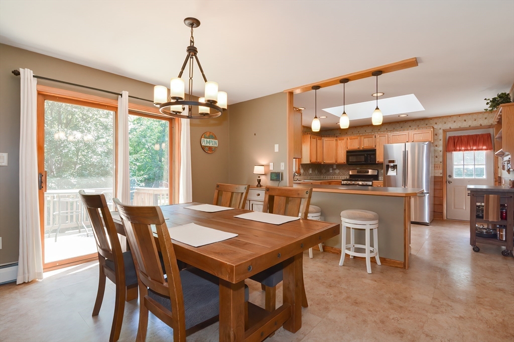 100 Cutler Road Warren, MA 01083 - Photo 11 of 42 a view of a dining room with furniture window and outside view