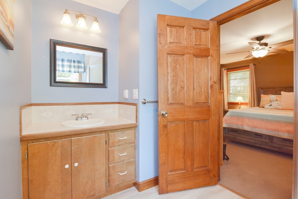 100 Cutler Road Warren, MA 01083 - Photo 19 of 42 a en suite bathroom with a granite countertop sink and a mirror