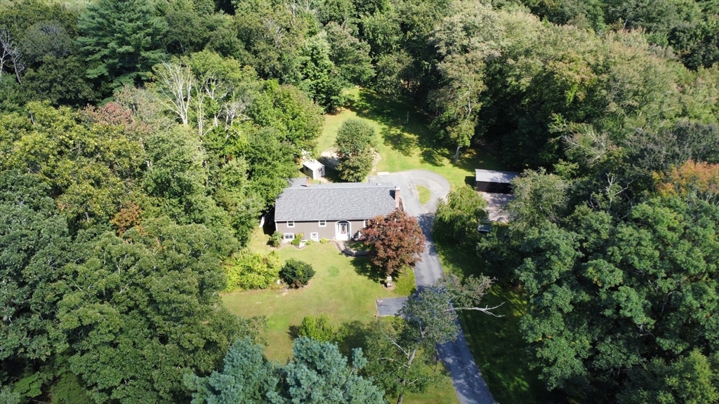 100 Cutler Road Warren, MA 01083 - Photo 3 of 42 an aerial view of residential house with outdoor space and trees all around