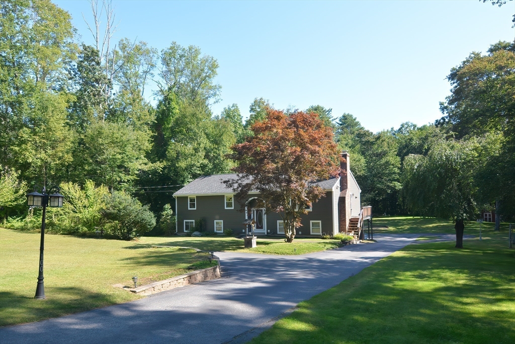 100 Cutler Road Warren, MA 01083 - Photo 4 of 42 a view of swimming pool with large trees and a big yard with a small yard