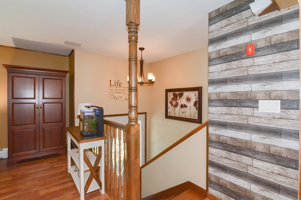 100 Cutler Road Warren, MA 01083 - Photo 6 of 42 a view of a hallway with wooden floor and staircase