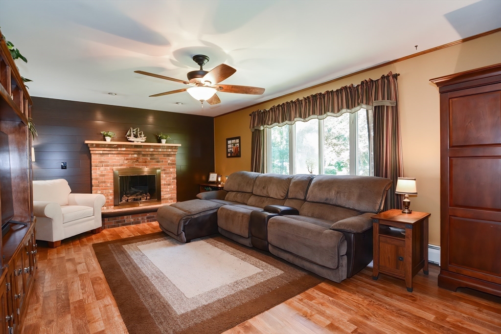 100 Cutler Road Warren, MA 01083 - Photo 7 of 42 a living room with furniture and a fireplace