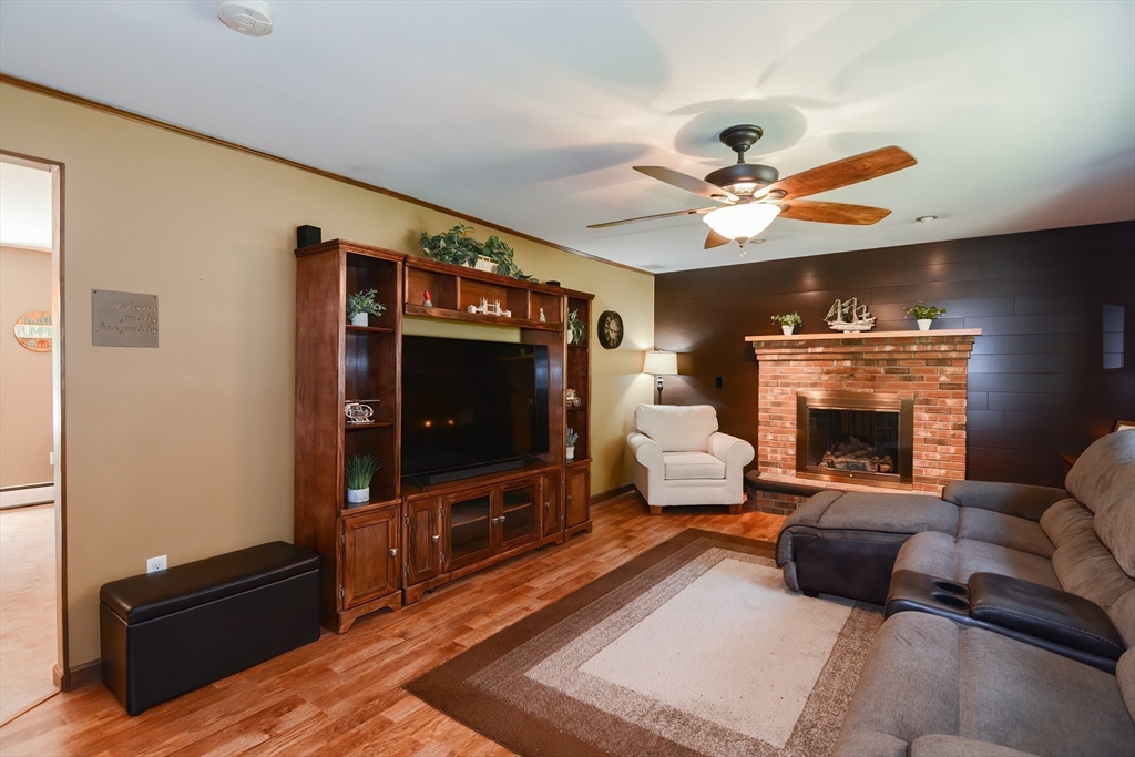 100 Cutler Road Warren, MA 01083 - Photo 8 of 42 a living room with furniture and a fireplace