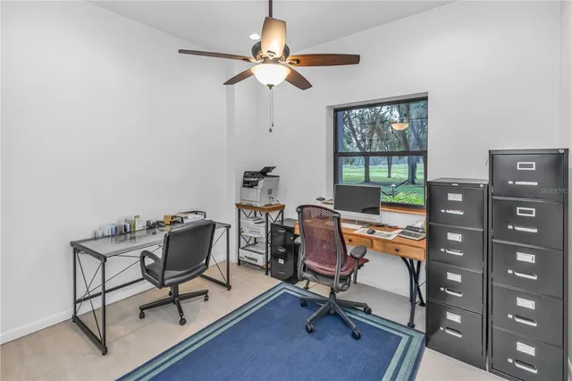 a bedroom with furniture and a large window