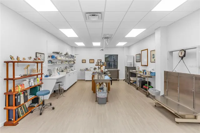 a kitchen with stainless steel appliances a sink stove and cabinets