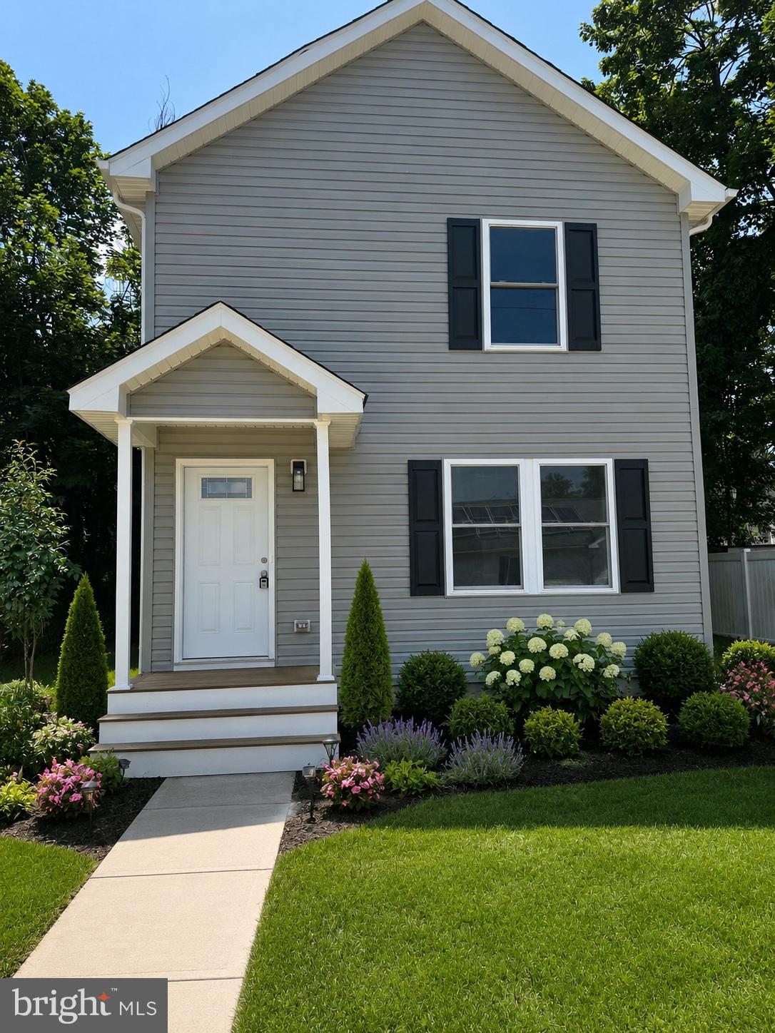 210 West 2nd Street Ridgely, MD 21660 - Photo 2 of 36 a front view of a house with a garden