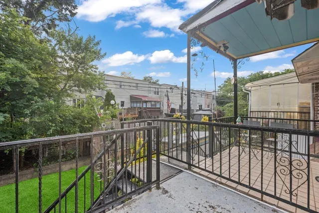 a view of a balcony with city view