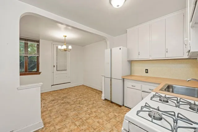 a kitchen with a stove and a refrigerator