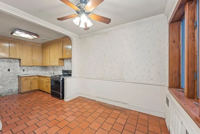 a kitchen with a cabinets and appliances