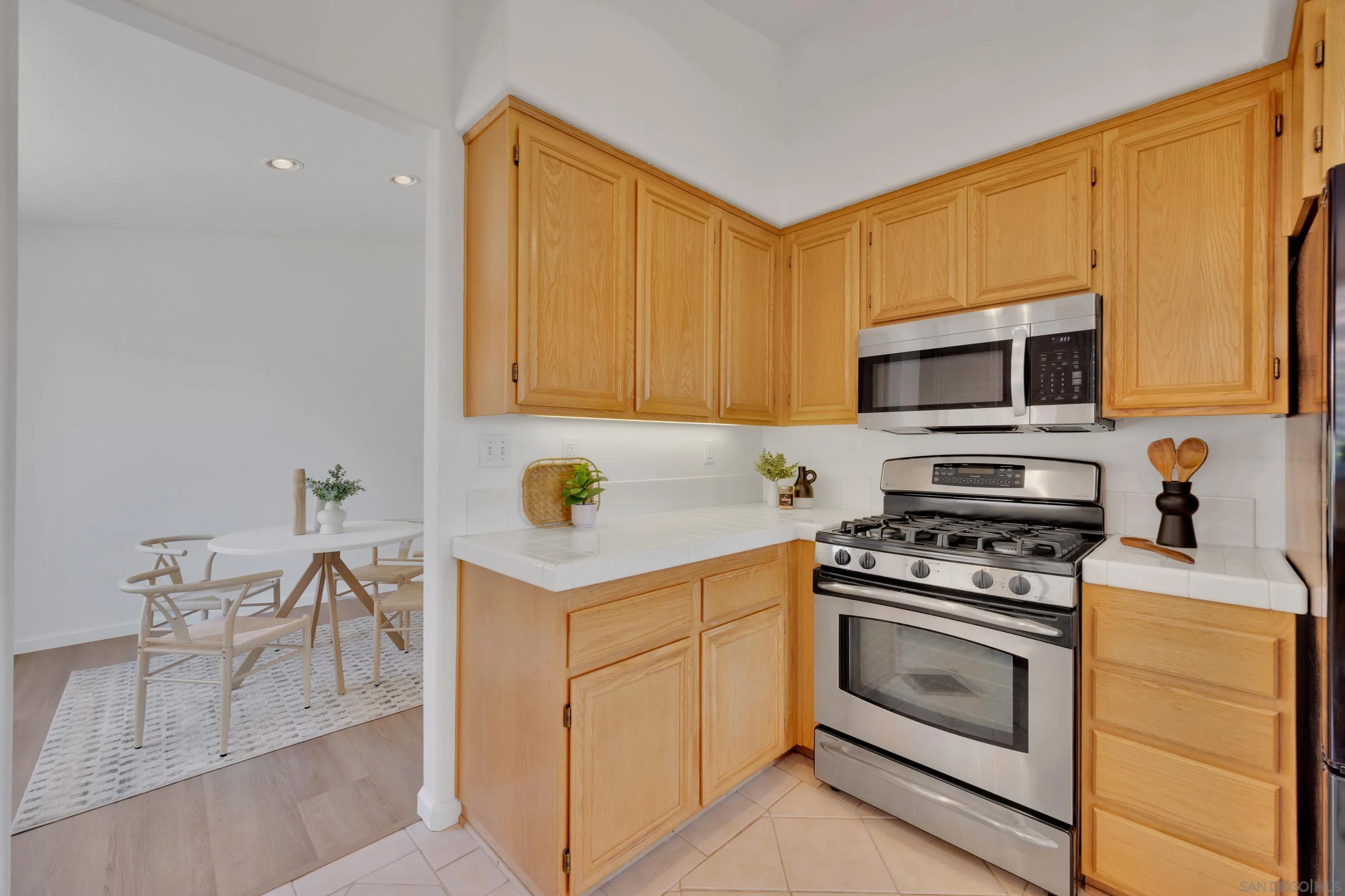 2334 Columbine Road Alpine, CA 91901 - Photo 12 of 42 a kitchen with a stove a sink and a microwave
