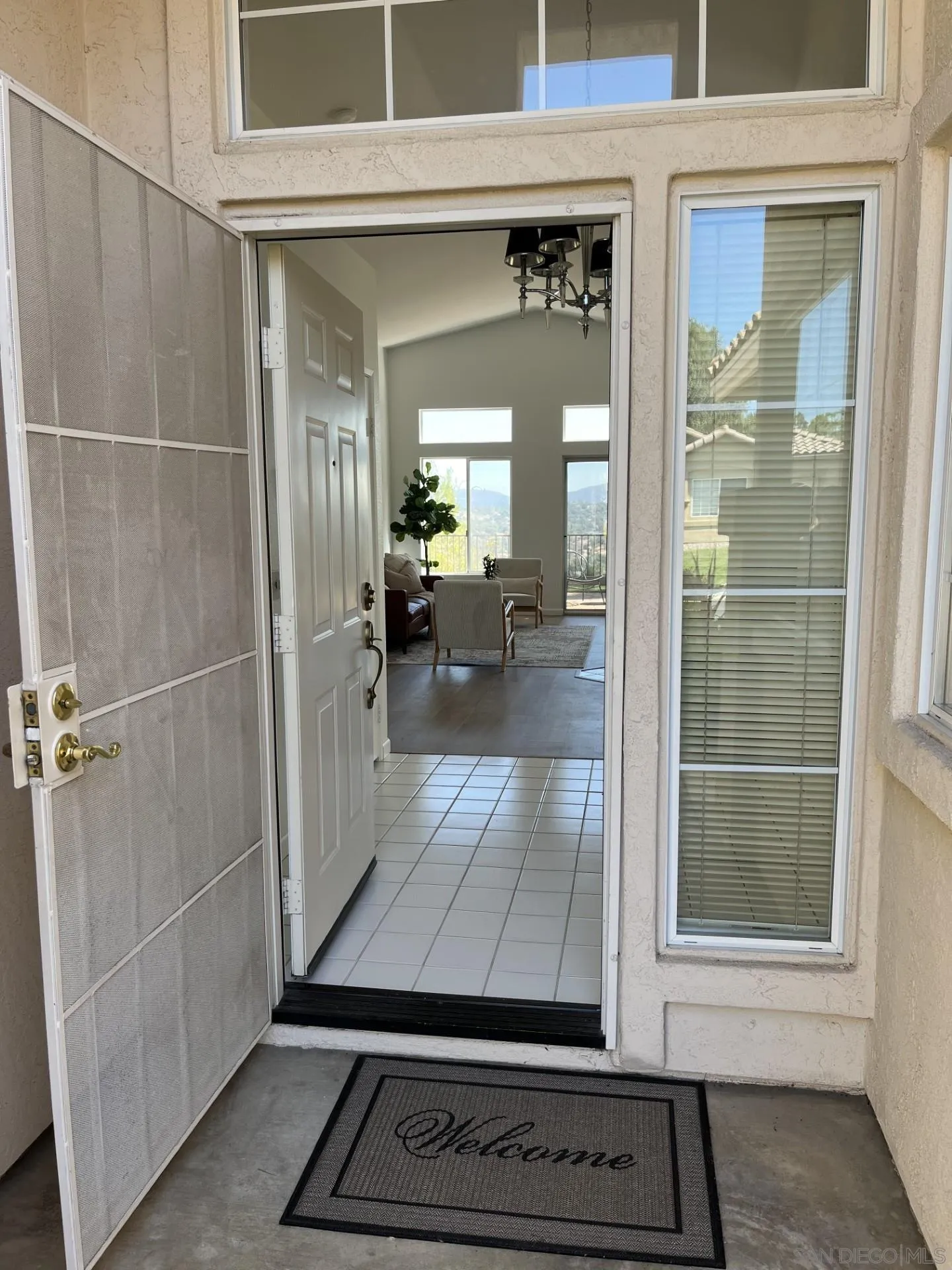 2334 Columbine Road Alpine, CA 91901 - Photo 2 of 42 a view of a hallway with dining area and glass door