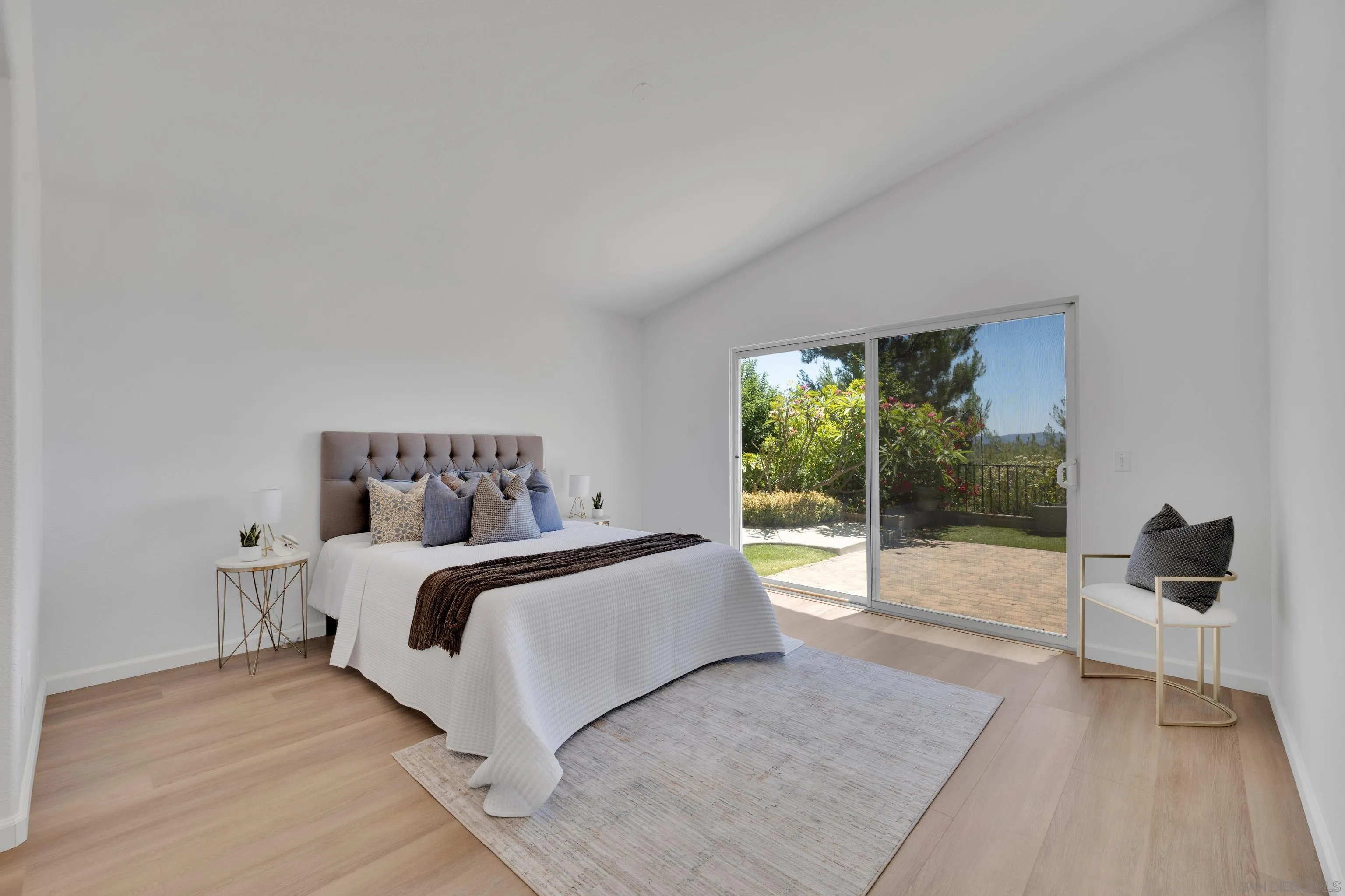 2334 Columbine Road Alpine, CA 91901 - Photo 32 of 42 a spacious bedroom with a bed and a large window